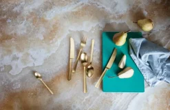 Georg Jensen Copenhagen bestickset 16 delar, guldtonat rostfritt stål