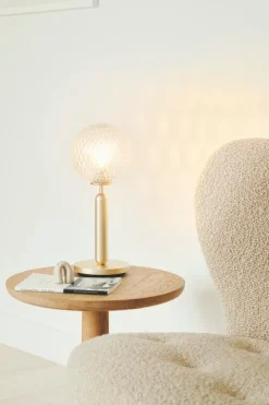 Nuura Miira bordslampa, mässing - optiskt klar