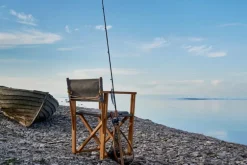 Skargaarden Kryss lounge stol, teak - mörkgrå Sunbrella Heritage